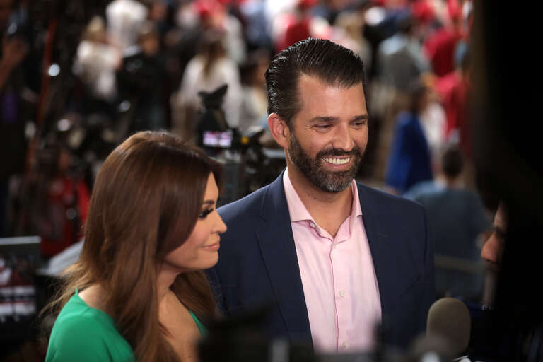Kimberly Guilfoyle and Donald Trump, Jr. speaking with the media at a &quot;Keep America Great&quot; rally for President of the United States Donald Trump at Arizona Veterans Memorial Coliseum in Phoenix, Arizona.

Please attribute to Gage Skidmore if used