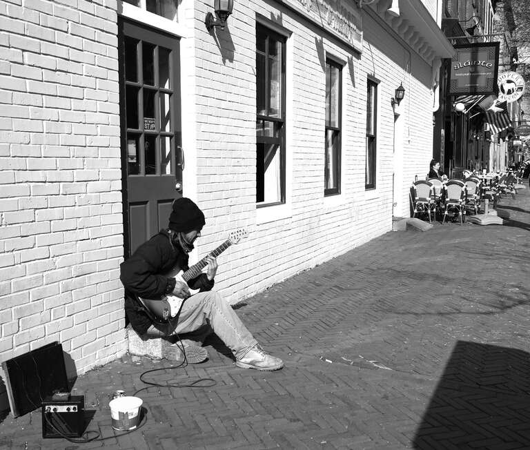 A guitarist plays in the Fells Point neighborhood, Baltimore