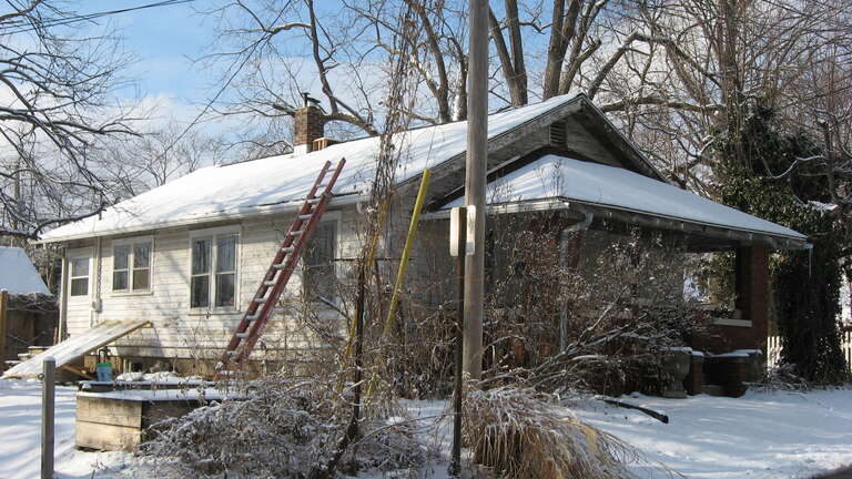 Front and southern side of the house located at 209 N. Maple Street in Bloomington, Indiana, United States.  Built in 1920, it is a part of the Bloomington West Side Historic District, a historic district that is listed on the National Register of
