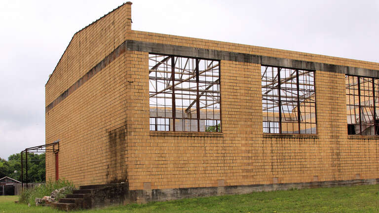 South and west sides of the old Martindale High School gymnasium in Martindale, Texas, United States