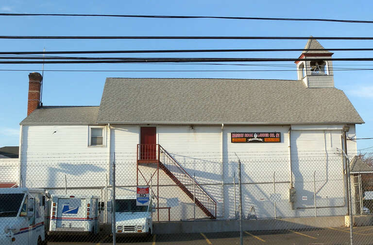 Looking north at Hook and Ladder Company 1 firehouse at Hawthorne and Corona Streets in eastern en:Valley Stream, New York on a sunny late afternoon.