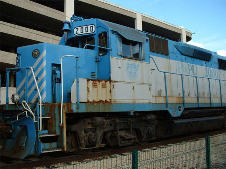 Peoria and Pekin Union Railway engine No. 2000 at Peoria, IL on October 23, 2004. Taken just south of the Murray Baker Bridge on the western side of the Illinois River.  (NE Water Street at Hamilton Boulevard; Caterpillar headquarters parking deck in