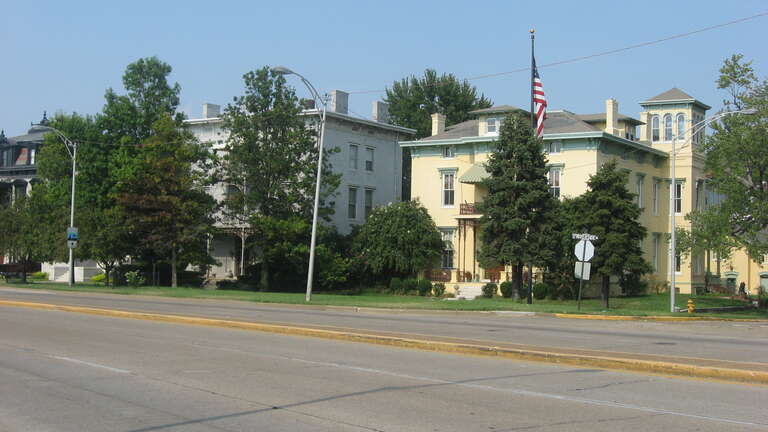 Houses in the 400 block of SE. Riverside Drive in Evansville, Indiana, United States.  From left to right:
408 Riverside: Jabez Woolley House, Neoclassical, built 1895.
414 Riverside: Richard Raleigh House, Italianate, built 1870.
420 Riverside: John