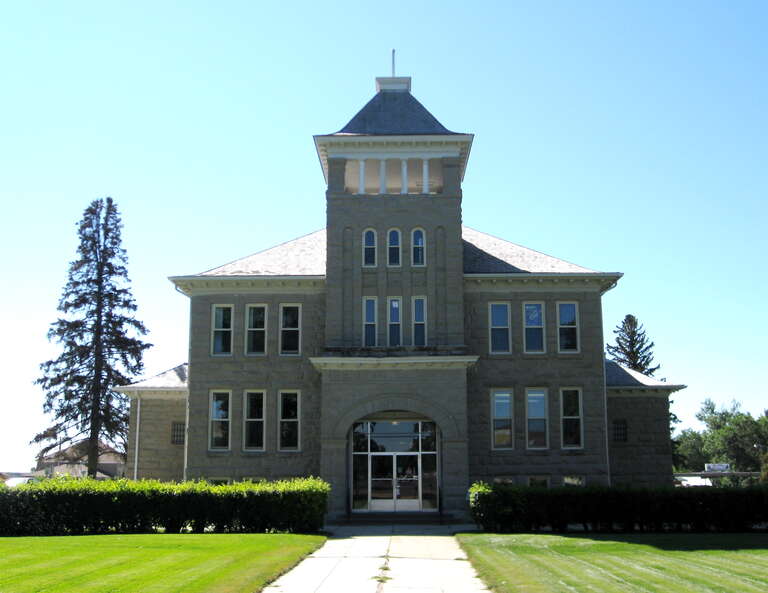Teton County Courthouse, Choteau, Montana, United States.  Finished in 1906, and built of local sandstone, it was designed by Joseph Gibson and George Stanley of Kalispell, Montana.