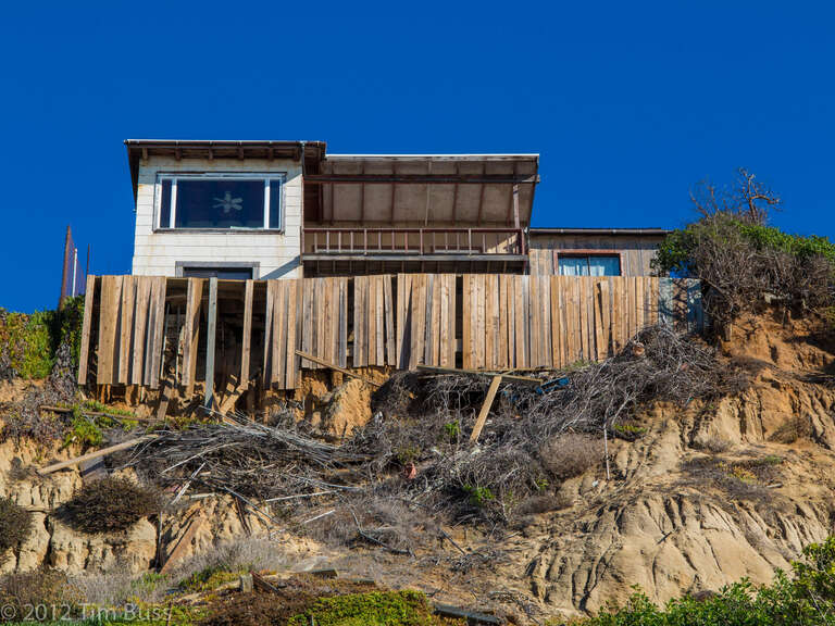 There are many houses perched on the bluffs along the Encinitas coastline, trying to delay the inevitable.

All my pics on Flickr may be freely used for non-commercial use, with attribution please