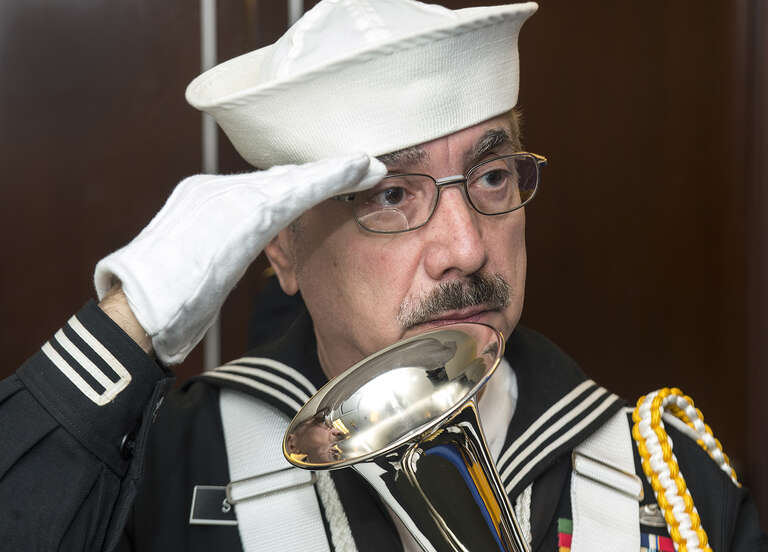 Harry Strano, from Central Electric Shop, in TIS Div, Subway Dept, and leader of the TVA Color Guard gives hand salute during singing of National Anthem at Transit Veterans Recognition Day ceremony at 2 Broadway, November 1, 2013. MTA / Patrick