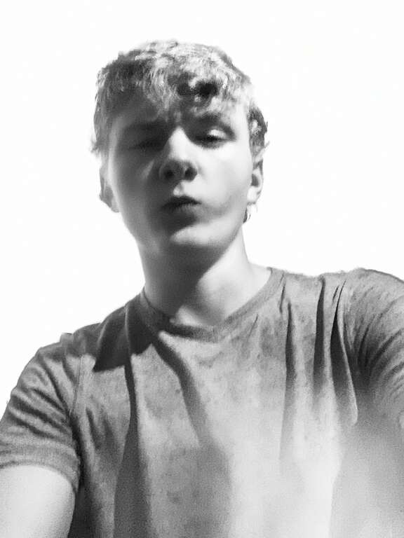 Wilson is striking a silly pose to create humor