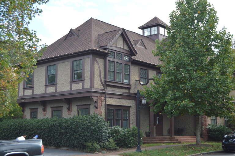 Front and northern side of World News Group offices, located on All Souls Crescent at Angle Street in the Biltmore Village neighborhood of Asheville, North Carolina, United States.