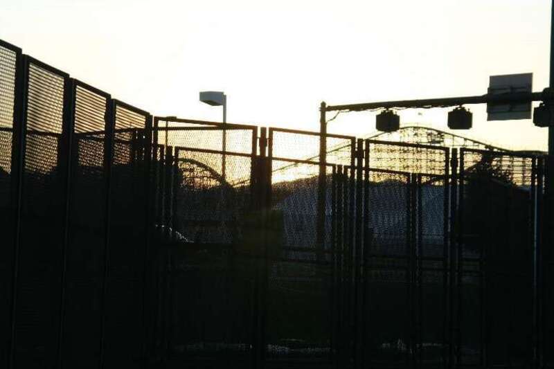 Roller coaster behind fencing for the Democratic National Convention.