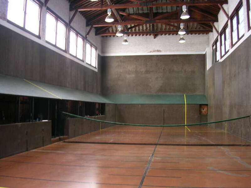 Interior of the Aiken Tennis Club constructed in 1902 at 146 Newberry Street, SW in Aiken, South Carolina, USA.  View of the court's hazard side taken from the service side.  33°33′34″N 81°43′16″W﻿ / ﻿33.55944°N 81.72111°W﻿ / 33.55944; -81.72111