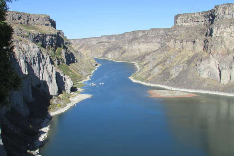 Snake River Canyon below Shoshone Falls is 460 ft deep and just over a mile and a quarter to the bend.