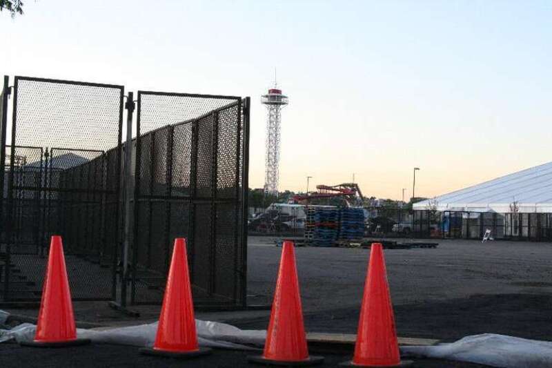Media tent(?), amusement park ride, protest cage(?), lifeline.