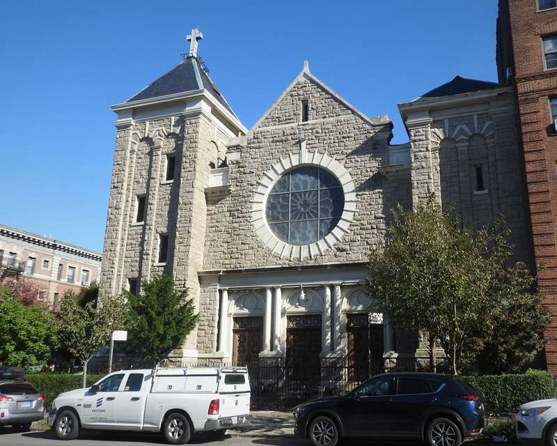 Looking east across Underhill at church on a sunny afternoon
