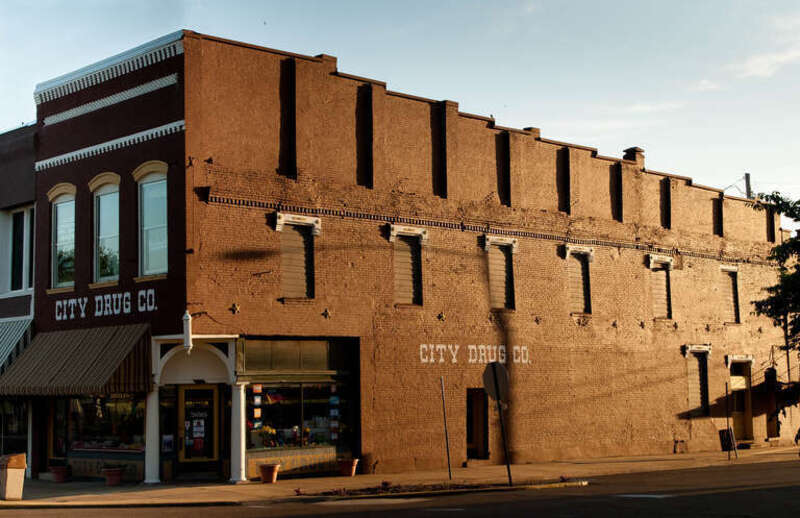 This is a photo of City Drug Co in downtown Dyersburg, TN at sunset. The building represents the style of architecture in the area.