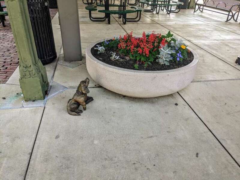 In 2023, a series of bronze sculptures were installed in various locations around Springfield, Illinois depicting Abraham Lincoln's dog, Fido. &quot;Fido Sniffing Flower Pot&quot; was designed by Danny Brikshavana and is installed on the north east corner of