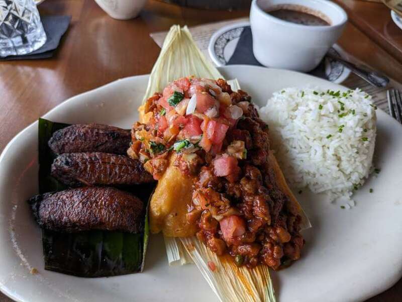 A tamal with rice and plantains served at La Bodeguita de Mima, a Cuban restaurant in Louisville, Kentucky, United States.