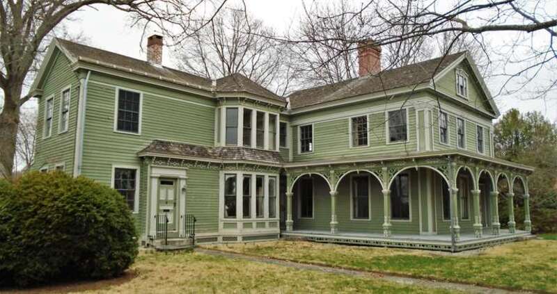 The George Greenman House at 47 Greenmanville Avenue in Mystic, Connecticut was built in 1839 in the Greek Revival style for George Greenman, the oldest of three brothers who founded the George Greenman &amp;amp; Co. shipyard. The porches with their
