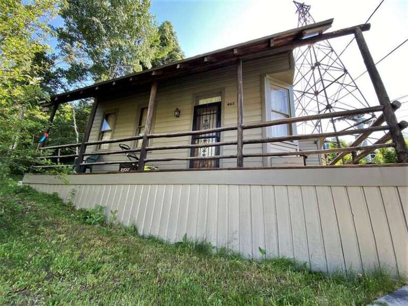 Henry M. Hinsdill House  Site is not easily photographed, as it is located on a steep slope, sandwiched in between a walking path and the chair lift without street access.
