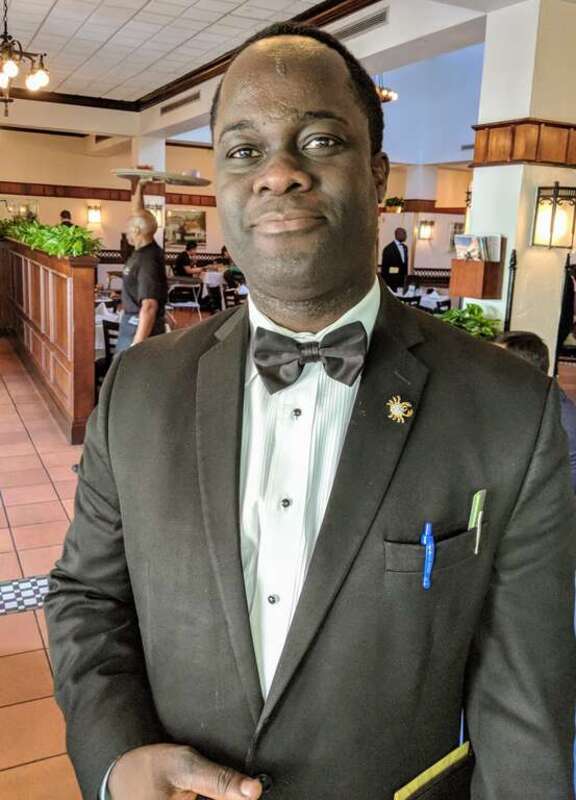A waiter at Joe's Stone Crab, a restaurant in Miami Beach, Florida. Photo by Jim Heaphy.