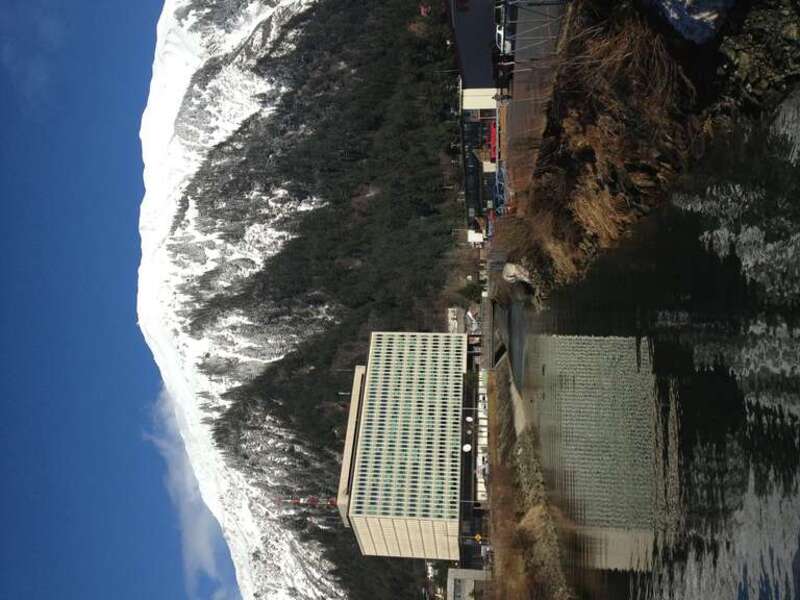 Juneau Federal Building with reflection in Gold Creek, and Mount Roberts - Southeast Alaska by Gillfoto