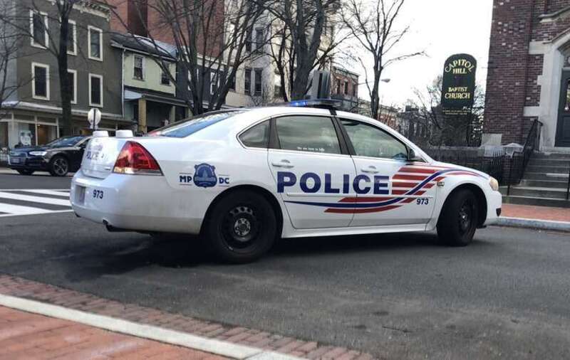 An MPD Chevrolet Caprice PPV police car blocking a road.