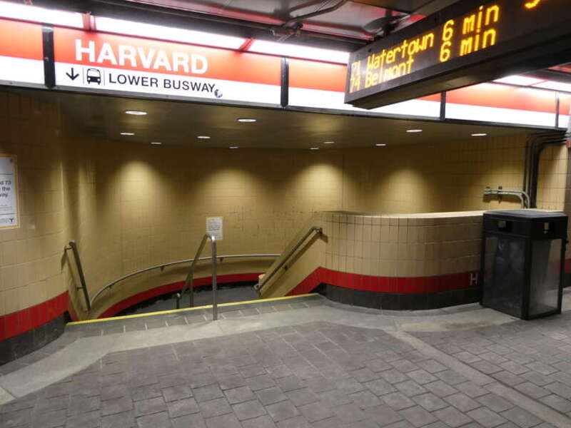 Stairs from the upper busway to the lower busway of the Harvard Bus Tunnel in March 2022