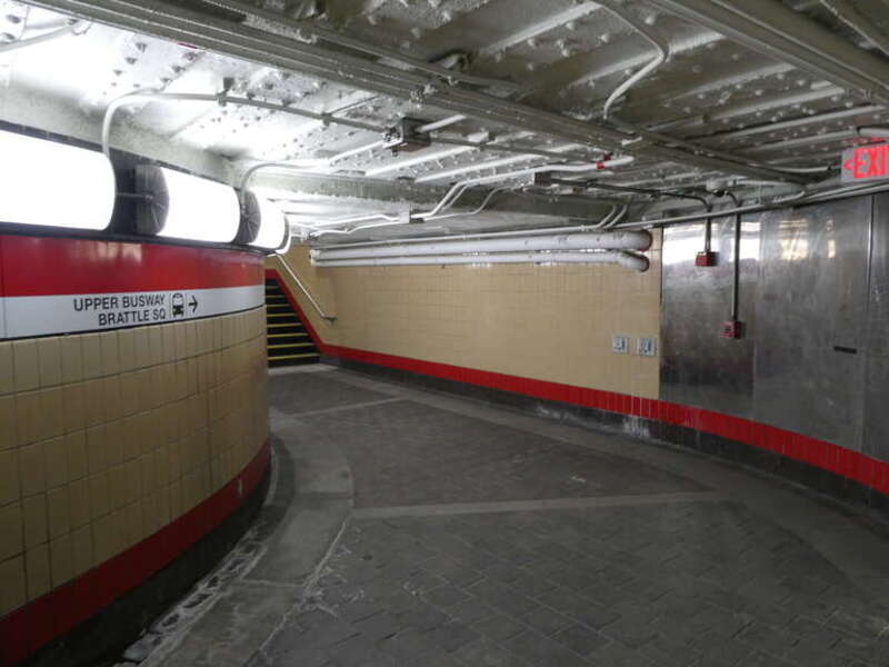 Stairs from the lower busway to the upper busway of the Harvard Bus Tunnel in March 2022