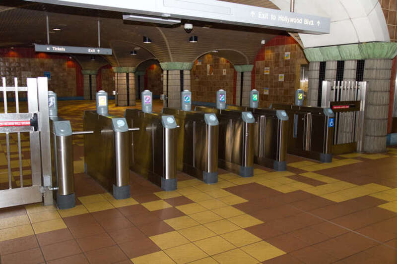 So if you have a TAP card, you tap it here.  If you don't, you just walk through--the bar won't stop you.  I suppose they're passenger counters, but at every station there's always one slightly wider turnstile with no bar at one end.  So....