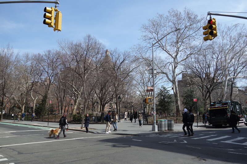 The entrance into the southwest corner of Washington Square Park, at the northeast corner of MacDougal Street (Washington Square West) and West 4th Street (Washington Square South) in Greenwich Village, Lower Manhattan.