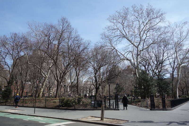 The entrance into the southwest corner of Washington Square Park, at the northeast corner of MacDougal Street (Washington Square West) and West 4th Street (Washington Square South) in Greenwich Village, Lower Manhattan.