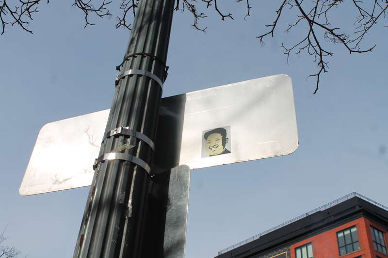 SMEAR LEADER North Korean Supreme Leader Kim Jong-un Sticker on back of sign on T near 14th Street, NW, Washington DC on Wednesday morning, 20 January 2016 by Elvert Barnes Photography

Visit SMEAR LEADER website at &amp;lt;a