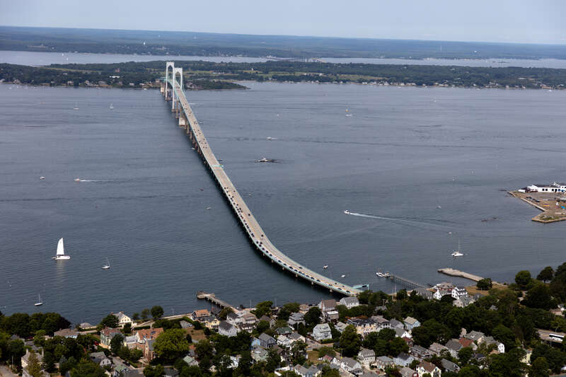 Aerial view of Claiborne Pell Bridge, commonly known as the Newport Bridge, a suspension bridge operated by the Rhode Island Turnpike and Bridge Authority that spans the East Passage of the Narragansett Bay in Rhode Island. The bridge, opened in 1969
