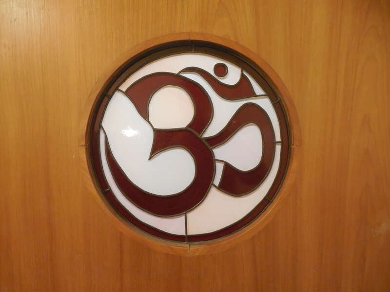 Om symbol on the Main Hall doorway, Kripalu Center for Yoga &amp;amp; Health, Stockbridge, MA, 2014.  For the Kripalu Center's description of the meaning of the symbol, read Valerie Reiss's article at: https://kripalu.org/article/1510/