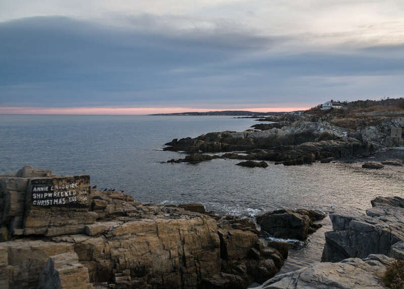 This sign painted on the rocks immediately adjacent to the Portland Head Light in Cape Elizabeth, Maine commemorates the wreck of a sailing ship on these rocks on Christmas Eve 1886.
Annie C. Maguire was a British three-masted bark, sailing from