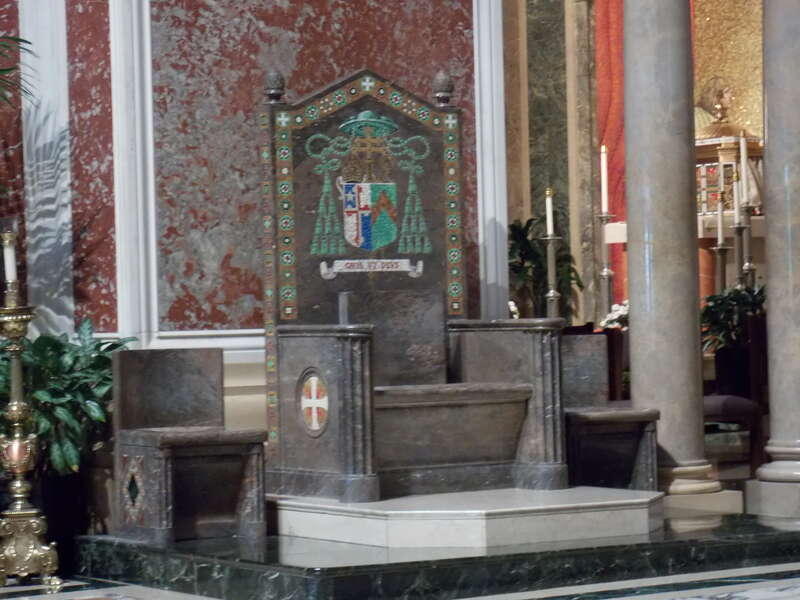 The cathedra in the Cathedral of St. Matthew the Apostle in Washington, D.C.  The coat of arms of Archbishop Michael Curley, the first Archbishop of Baltimore-Washington are on the back of the chair.  The cathedral is listed on the National Register