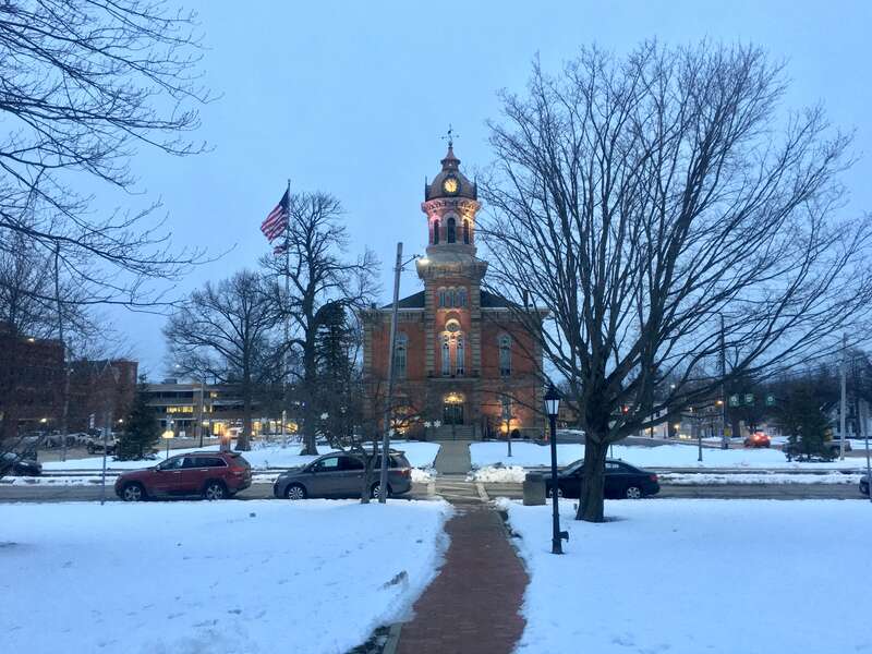 View of the Geauga County Courthouse at blue hour from the gazebo at the center of Chardon Square, Chardon, Ohio, February 2020.