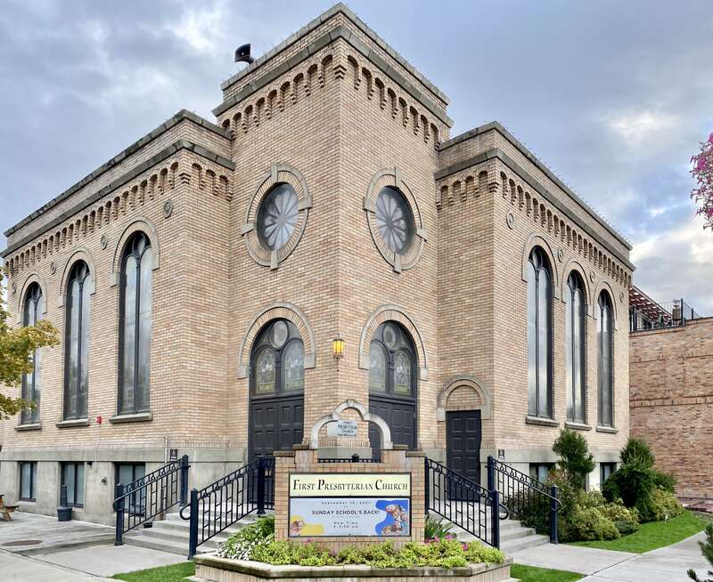 Built in 1921, this stripped and stark Romanesque Revival-style church, home to a Presbyterian congregation, stands at the corner of Central Avenue and 3rd Street in downtown Whitefish, Montana.