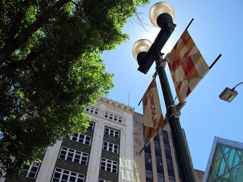 Lincoln, Nebraska; as seen on a spring day along &quot;O&quot; Street in downtown Lincoln.  The Miller &amp;amp; Paine Building can be seen in the bottom and the &quot;O&quot; Street Skywalk in the far bottom-right of this photo.