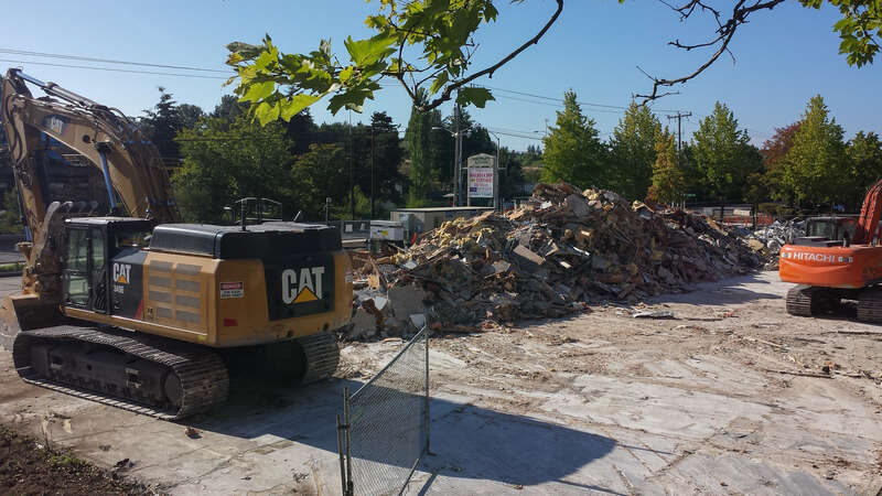 Buildings of a strip mall called Northgate Station have been demolished for a staging/parking area for the future Northgate Station (light rail) under construction