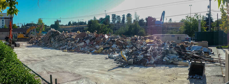 Buildings of a strip mall called Northgate Station have been demolished for a staging/parking area for the future Northgate Station (light rail) under construction