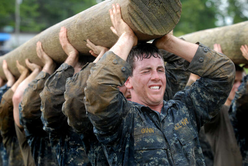 ANNAPOLIS, Md. (May 17, 2011) Plebes carry a modified telephone pole during the log PT station of Sea Trials, the capstone training exercise for Naval Academy freshmen. The plebes navigate physical and mental challenges, ranging from obstacle