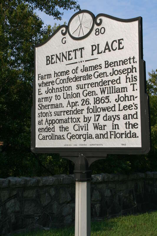 Sign describing Bennett Place in Durham, North Carolina.  The signs reads: &quot;Bennett Place -- Farm home of James Bennett, where Confederate Gen. Joseph E. Johnston surrendered his army to Union Gen. William T. Sherman, Apr. 26, 1865.  Johnston's