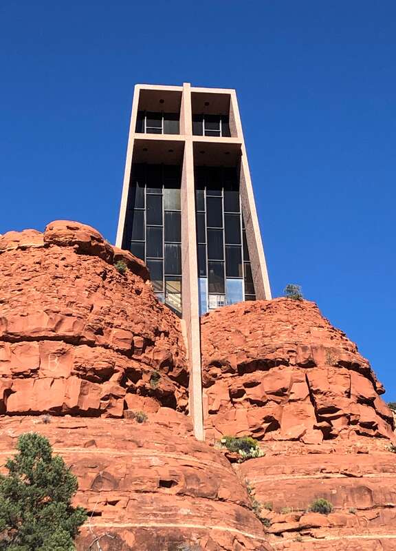 The Chapel of the Holy Cross is a Roman Catholic chapel built from 1954 to 1956 into the red rock buttes of Sedona, Arizona, within the Coconino National Forest. It was inspired and commissioned by local rancher and sculptor Marguerite Brunswig