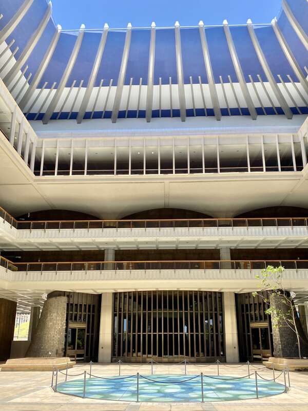 Built between 1965 and 1969, this modernist State Capitol building was designed by Belt, Lemon and Lo of Architects Hawaii Ltd., and John Carl Warnecke and Associates.  The building was built in a variant of Modernism known as the “Hawaiian