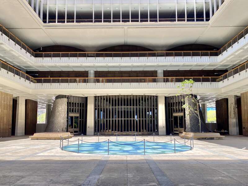 Built between 1965 and 1969, this modernist State Capitol building was designed by Belt, Lemon and Lo of Architects Hawaii Ltd., and John Carl Warnecke and Associates.  The building was built in a variant of Modernism known as the “Hawaiian