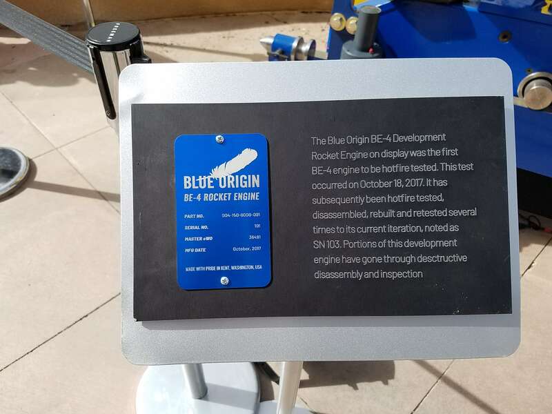The plate reads:
BLUE ORIGIN
BE-4 ROCKET ENGINE
Part no. 004-150-0000-001
Serial no. 101
Master eWO 36491
Mfg date October, 2017
Made with Pride in Kent, Washington USA

&quot;The BE-4, originally serial number 101, was manufactured in Kent, Washington