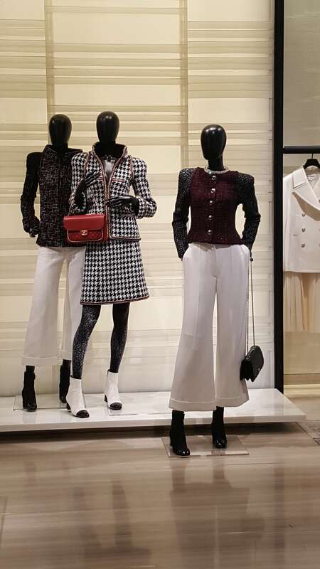 Chanel suits on display at a Neiman Marcus store