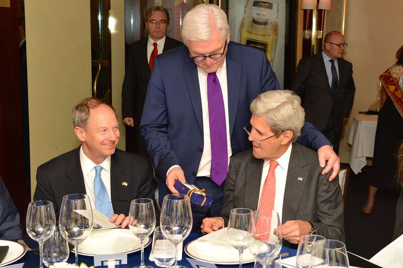 With U.S. Ambassador to Germany John Emerson looking on, German Foreign Minister Frank-Walter Steinmeier presents U.S. Secretary of State John Kerry a gift before their working dinner in Washington, D.C., on February 29, 2016. [State Department