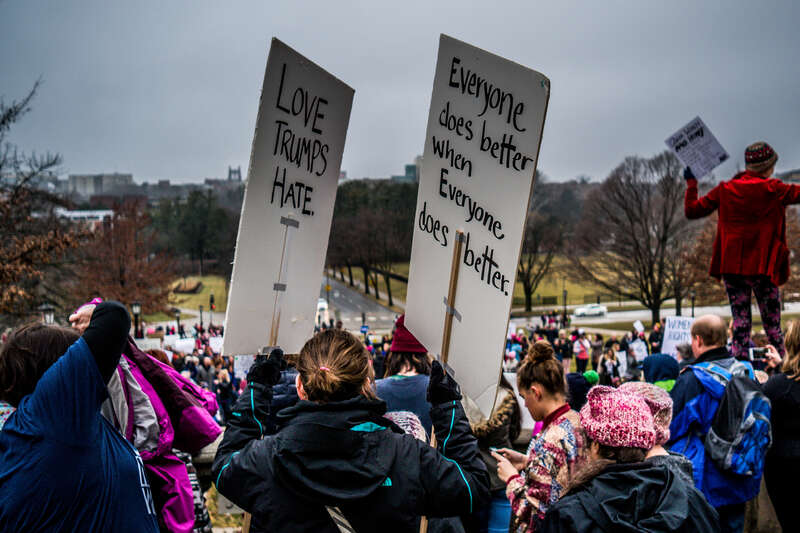 A crowd gathers at the Old Capitol for a local version of the Women's March in Iowa City.