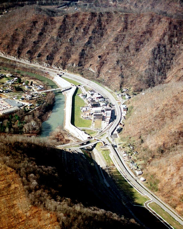 Matewan, West Virginia, USA, along the Tug Fork River. The town is protected by a large floodwall constructed by the U.S. Army Corps of Engineers. The river is the border between West Virginia and Kentucky; Kentucky is on the left and West Virginia